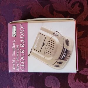 New never opened,in original packaging smallest clock radio with earbuds